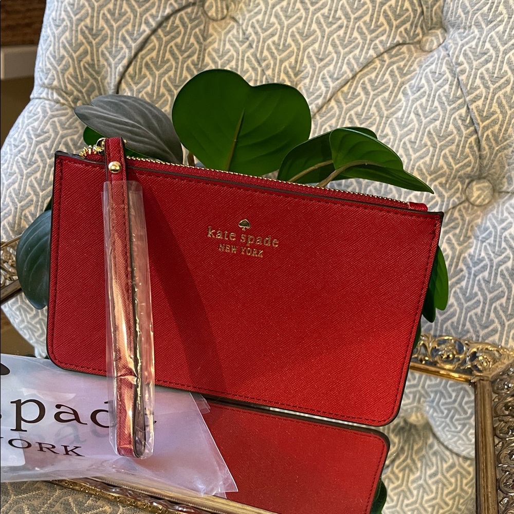 Brand new Kate Spade wristlet in wine